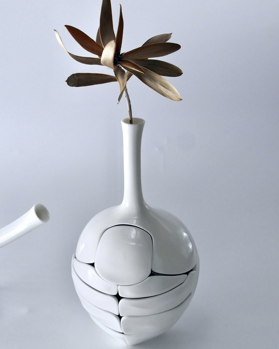 the beetle flower vase with an actual flower inside