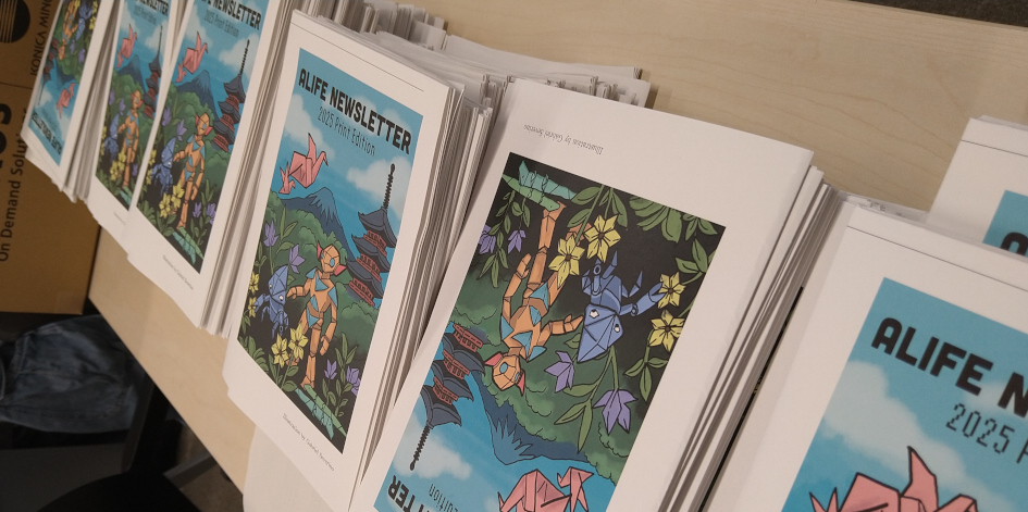 A photo of stacks of the print editions of the Newsletter